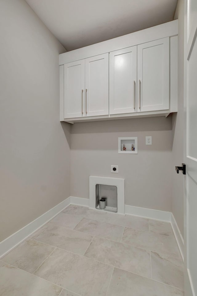 laundry area with cabinets, washer hookup, and electric dryer hookup