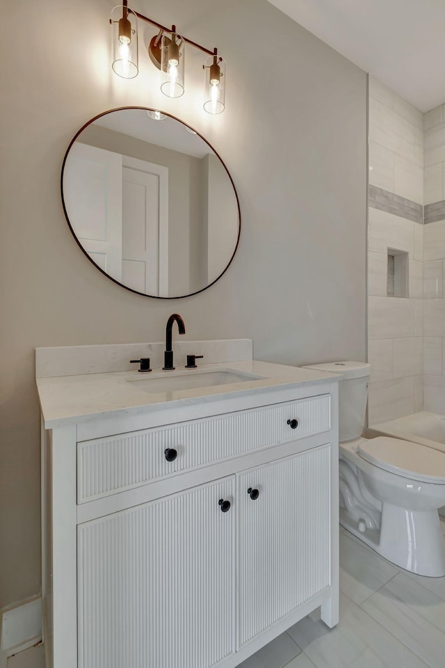 bathroom featuring vanity and toilet