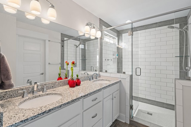 bathroom with vanity and walk in shower