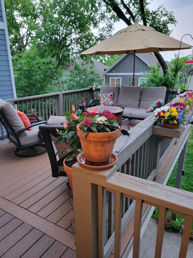 wooden terrace featuring an outdoor hangout area