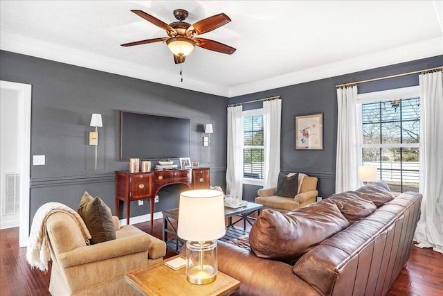 living room featuring crown molding, ceiling fan, and dark hardwood / wood-style floors