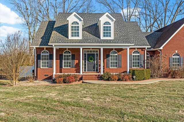 new england style home with a front yard