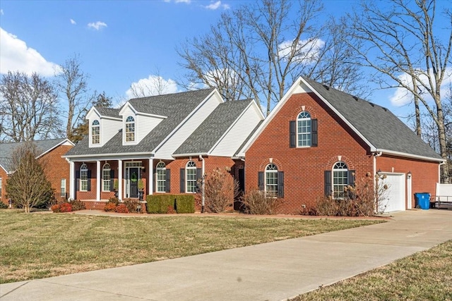 cape cod home featuring a garage, a front lawn, and covered porch