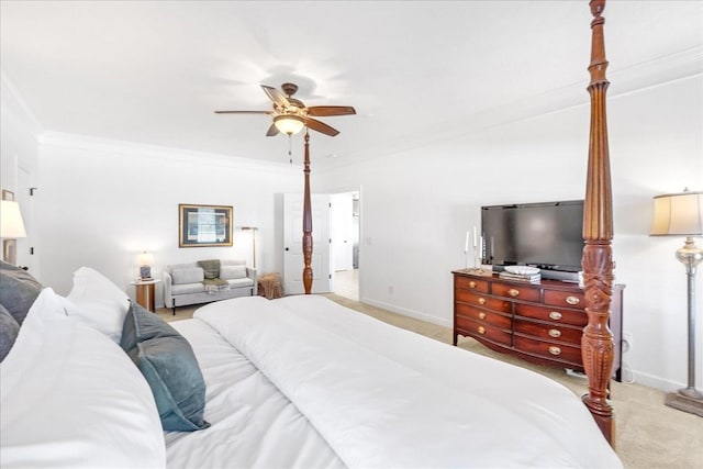 bedroom featuring ornamental molding, light colored carpet, and ceiling fan