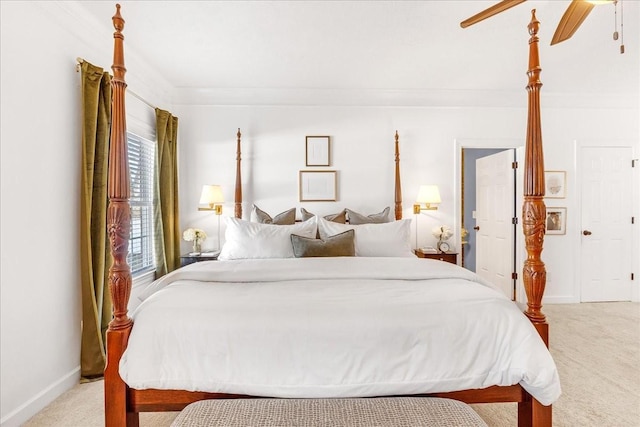 bedroom featuring crown molding, light colored carpet, and ceiling fan