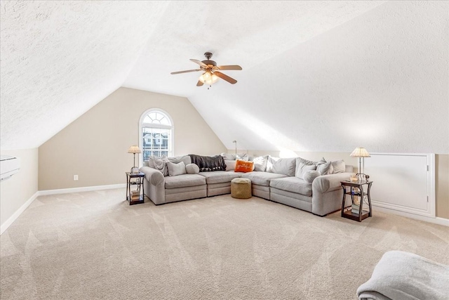 carpeted living room featuring vaulted ceiling, ceiling fan, and a textured ceiling