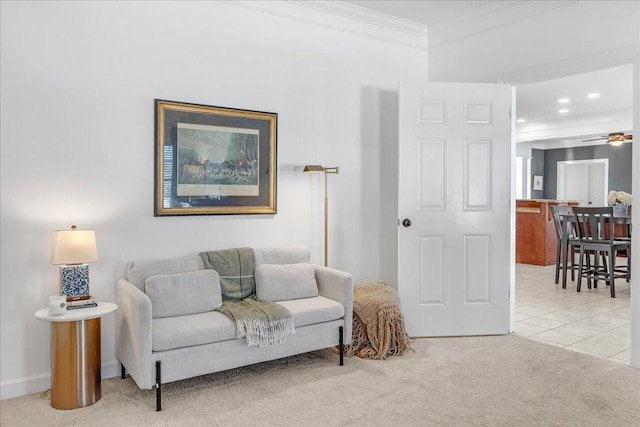 carpeted living room featuring crown molding and ceiling fan