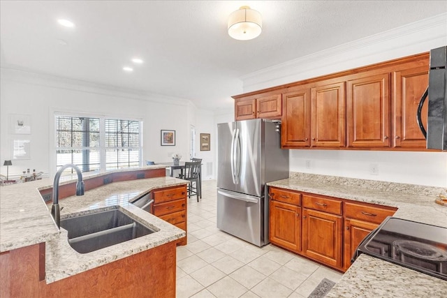 kitchen with sink, light stone counters, light tile patterned floors, ornamental molding, and appliances with stainless steel finishes