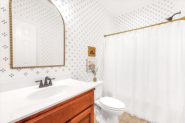 bathroom featuring tile patterned floors, vanity, and toilet