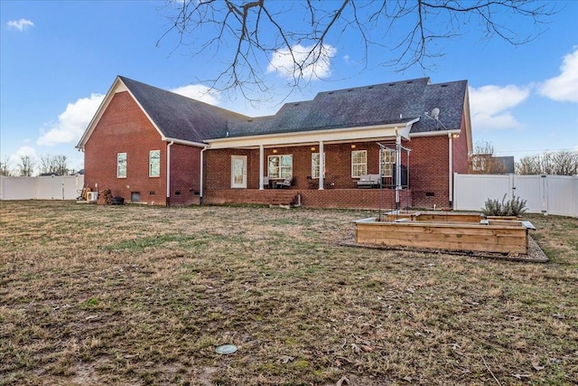 back of house with a yard