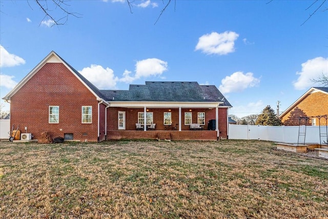 rear view of house with a lawn