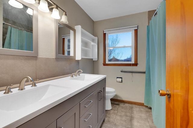 bathroom with tile patterned flooring, vanity, curtained shower, and toilet