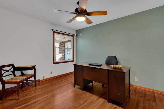 office area with ceiling fan and light wood-type flooring