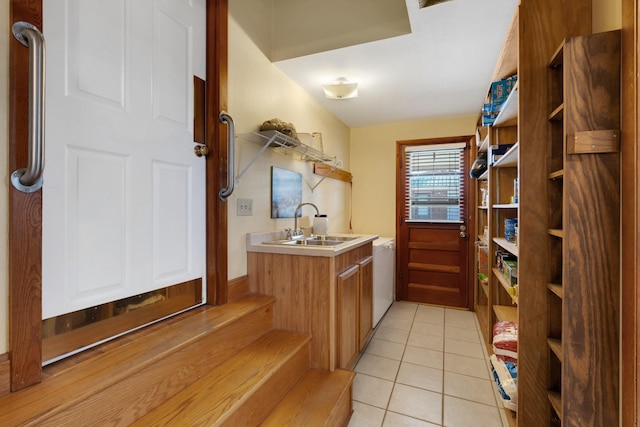 interior space featuring sink and tile patterned flooring