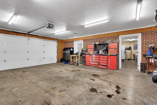 garage featuring a garage door opener and a workshop area