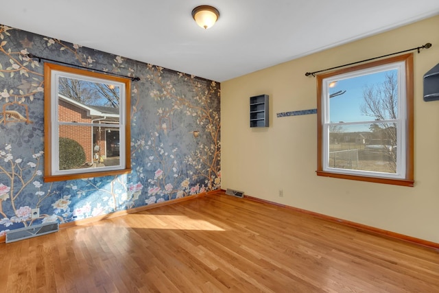 unfurnished room featuring hardwood / wood-style floors