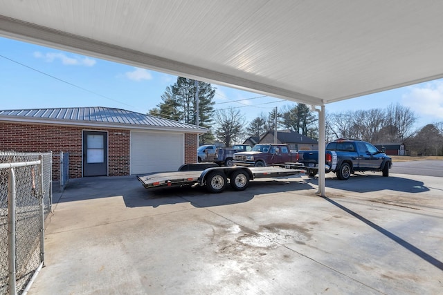 view of car parking featuring a garage