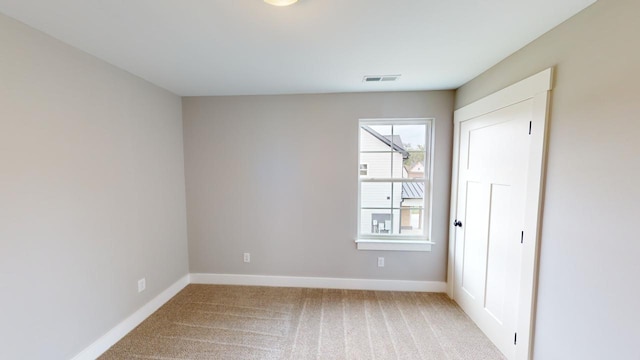 view of carpeted spare room