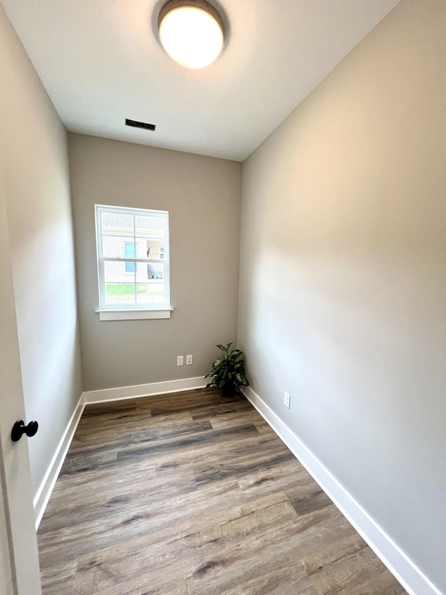 spare room featuring hardwood / wood-style floors