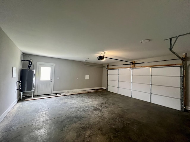 garage featuring a garage door opener and water heater