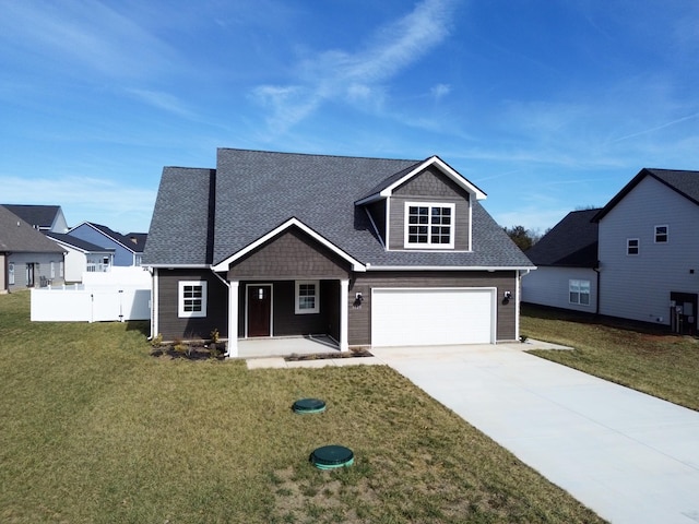 craftsman-style home featuring a garage and a front lawn