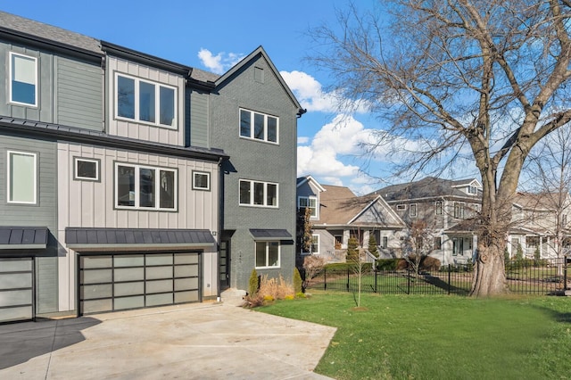 view of front of property with a garage and a front yard