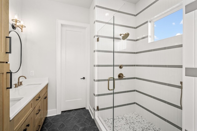 bathroom with walk in shower, tile patterned floors, and vanity