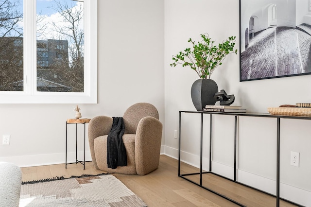 sitting room featuring light hardwood / wood-style flooring