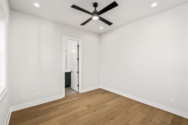 unfurnished room with ceiling fan and light hardwood / wood-style floors