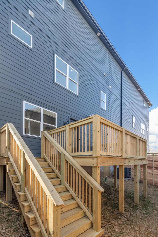 back of property featuring a wooden deck