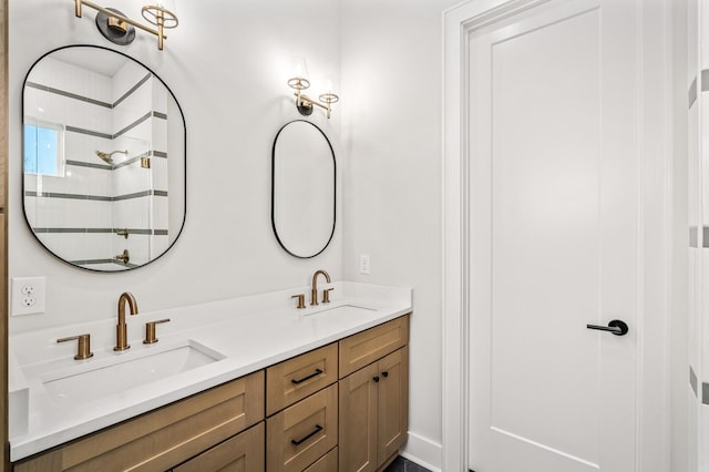 bathroom featuring vanity and tiled shower