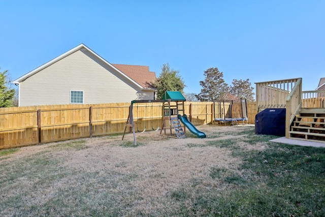 view of jungle gym featuring a trampoline and a yard