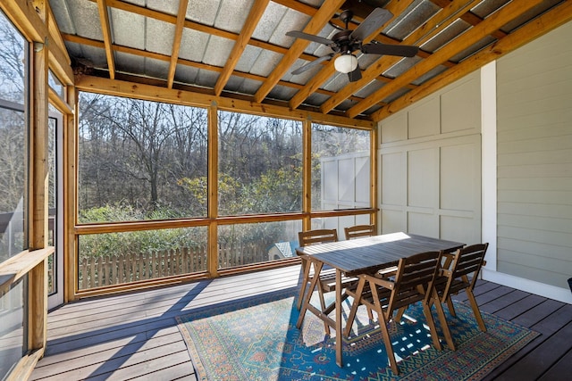 sunroom / solarium featuring ceiling fan