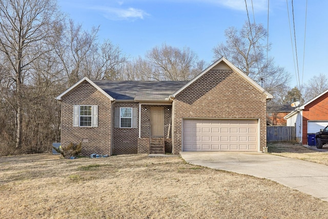 view of front of property featuring a garage and a front lawn