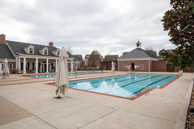 view of swimming pool with a patio area