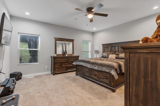 carpeted bedroom featuring ceiling fan