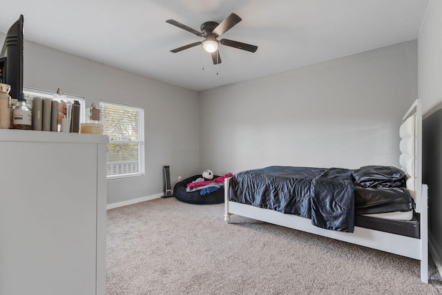 bedroom with ceiling fan and carpet flooring