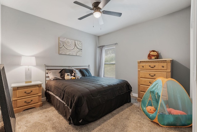 bedroom with ceiling fan and light carpet