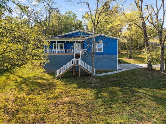 view of outdoor structure featuring a porch and a yard