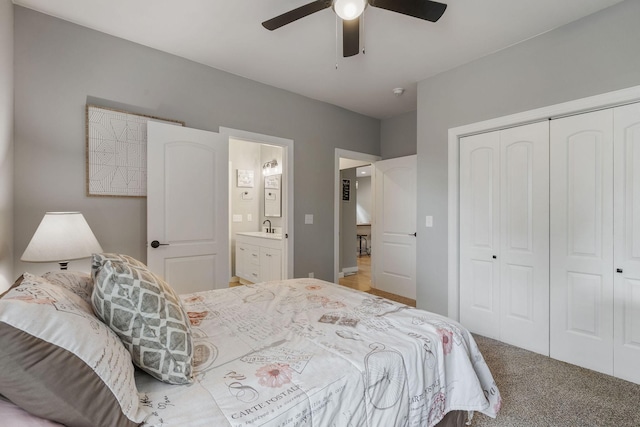 bedroom with carpet floors, sink, ceiling fan, and a closet