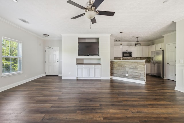 unfurnished living room featuring dark wood-type flooring, ceiling fan, ornamental molding, and a textured ceiling