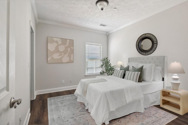 bedroom with dark hardwood / wood-style flooring, crown molding, and a textured ceiling