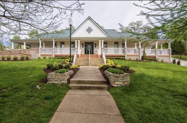 farmhouse-style home with covered porch and a front lawn