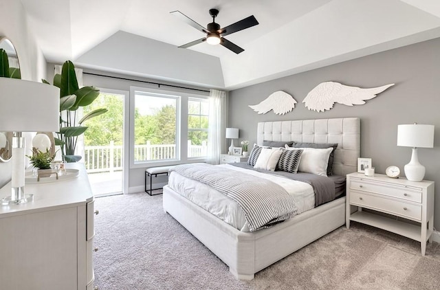 bedroom with vaulted ceiling, light colored carpet, access to exterior, and ceiling fan