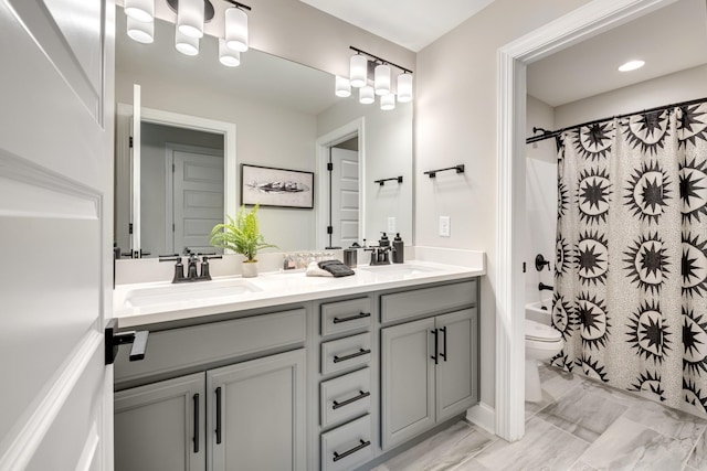 full bathroom featuring vanity, toilet, and shower / bath combo