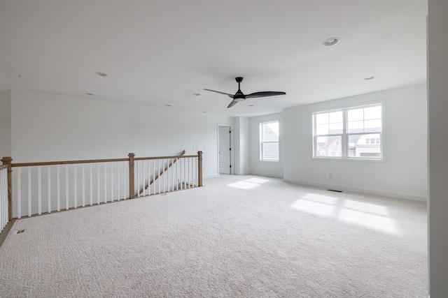 carpeted empty room with ceiling fan