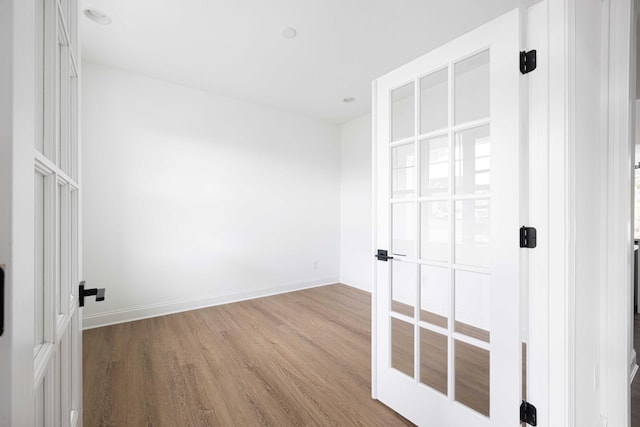 unfurnished bedroom featuring hardwood / wood-style flooring