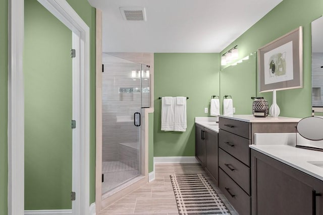 bathroom featuring vanity and walk in shower