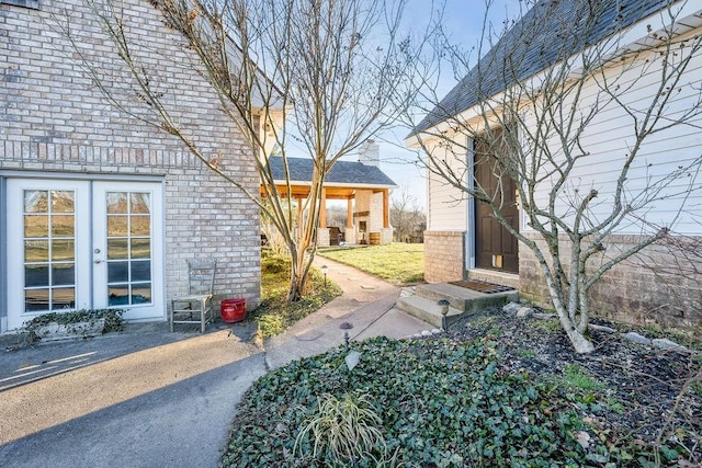 view of yard with french doors