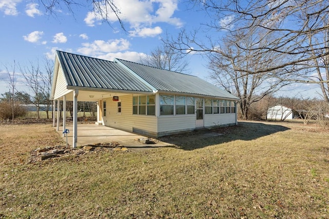 261 N Swamp Rd, Portland, TN 37148 - exterior space with a sunroom, a lawn, and a patio area